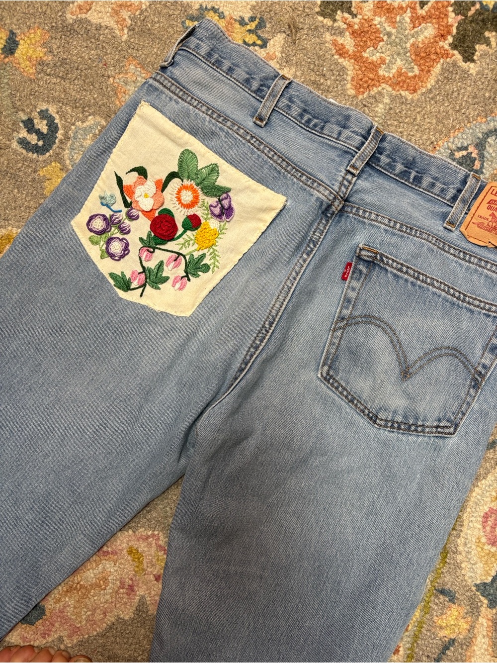 Levi’s Upcycled Slim Fit Jeans with Embroidered Floral Pocket